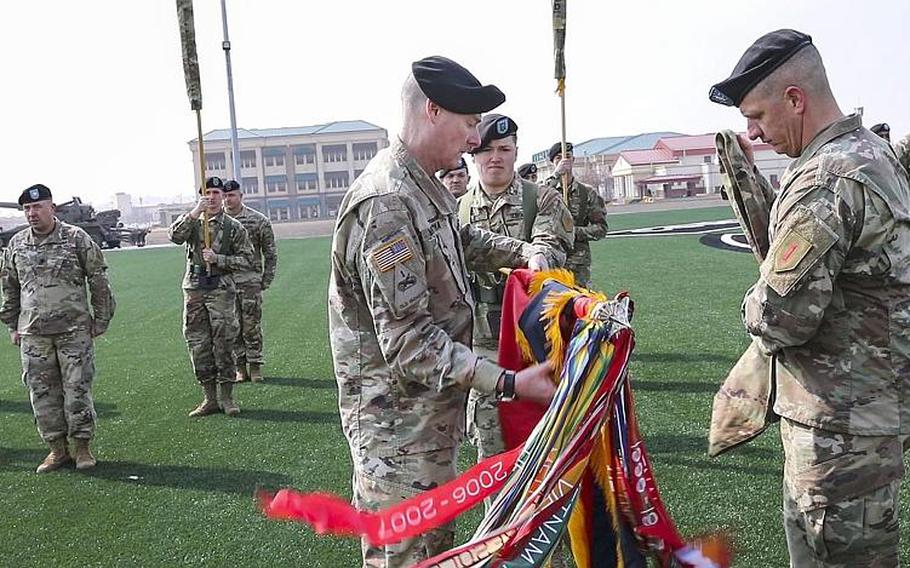 The 2nd Armored Brigade Combat Team, "Dagger" 1st Infantry Division, conducts a transfer of authority ceremony Wednesday, March 4, 2020, after arriving in South Korea for a nine-month rotation amid fears of the spread of a new coronavirus.