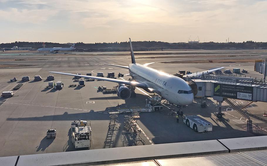 A Delta Air Lines plane is parked at a gate at Narita International Airport in Japan, March 9, 2019.