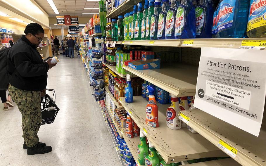 Petty Officer 1st Class Chateece Chappelle shops inside a Navy Exchange at Yokosuka Naval Base, Japan, Friday, March 13, 2020.  