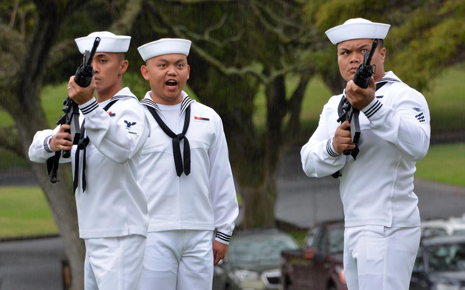 Honor guards fire a salute during the funeral of Seaman 2nd Class Hubert P. Hall at the National Memorial Cemetery of the Pacific, Hawaii, Tuesday, March 17, 2020.