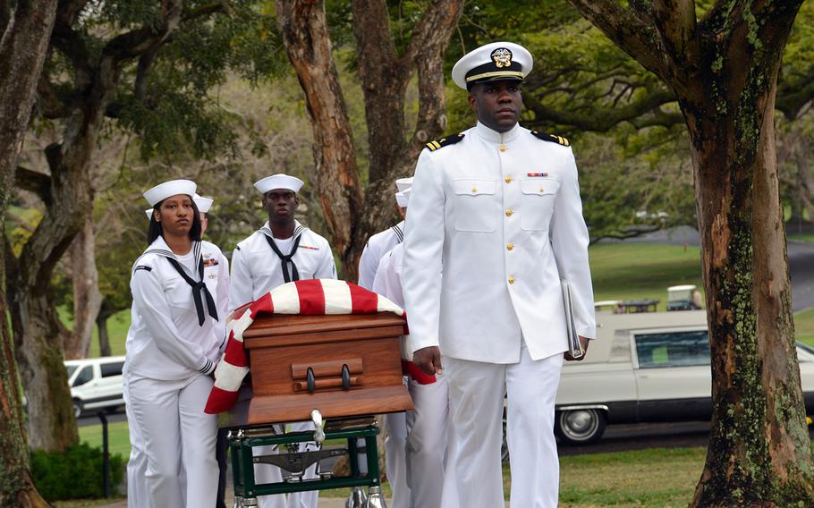 Navy pallbearers carry the casket of Seaman 2nd Class Hubert P. Hall at the National Memorial Cemetery of the Pacific, Hawaii, Tuesday, March 17, 2020. Hall was killed aboard the USS Oklahoma during the Japanese attack on Pearl Harbor.