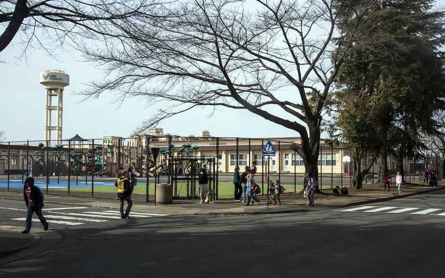 Students and families from Joan K. Mendel Elementary School at Yokota Air Base, Japan, walk home after classes on Feb. 28, 2020.