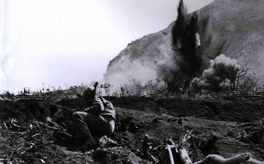 A Japanese position at the base of Mount Suribachi is eliminated by a high-explosive charge set off by the invading Marines during the Battle of Iwo Jima in this undated photo from 1945.