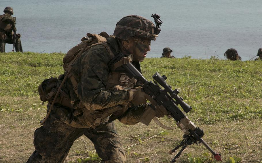 A Marine from the 31st Marine Expeditionary Unit takes part in a raid exercise in Kin, Okinawa, Feb. 9, 2020.