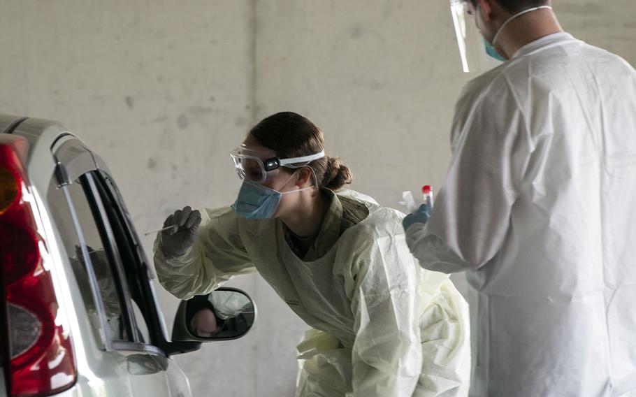 Members of the 18th Medical Group test for coronavirus at Kadena Air Base, Okinawa, March 20, 2020.