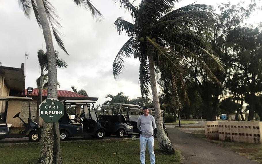 Palm Tree Golf Course manager Steven O'Hearne can only watch from his clubhouse, formerly the Andersen Air Force Base officer's club, as beetles gnaw their way through the palm trees outside.