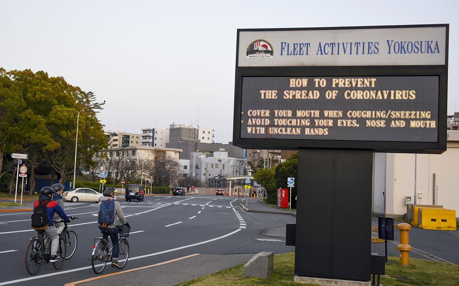 A sign displays coronavirus-prevention information at Yokosuka Naval Base, Japan, March 26, 2020.