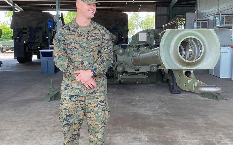 Marine 1st Lt. Kevin Heine of 3rd Battalion, 11th Marine Regiment, stands with an M777 howitzer in Darwin, Australia, after completing a mandatory 14-day self-quarantine on Wednesday, April 8, 2020.
