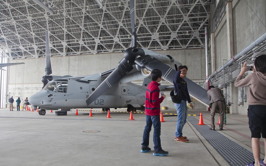 Okinawans tour Marine Medium Tiltrotor Squadron 265's hangar during an open house at Marine Corps Air Station Futenma, Okinawa, Japan, March 3, 2013.