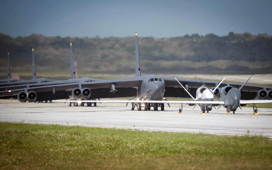 An Air Force RQ-4 Global Hawk, a Navy MQ-4C Triton and Air Force B-52 Stratofortresses line up for an "elephant walk" at Andersen Air Force Base, Guam, on Monday, April 13, 2020.