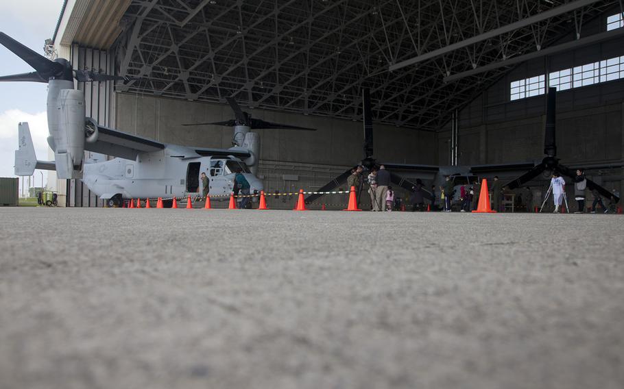 Locals tour an Osprey hangar at Marine Corps Air Station Futenma, Okinawa, during an open house on March 3, 2013.