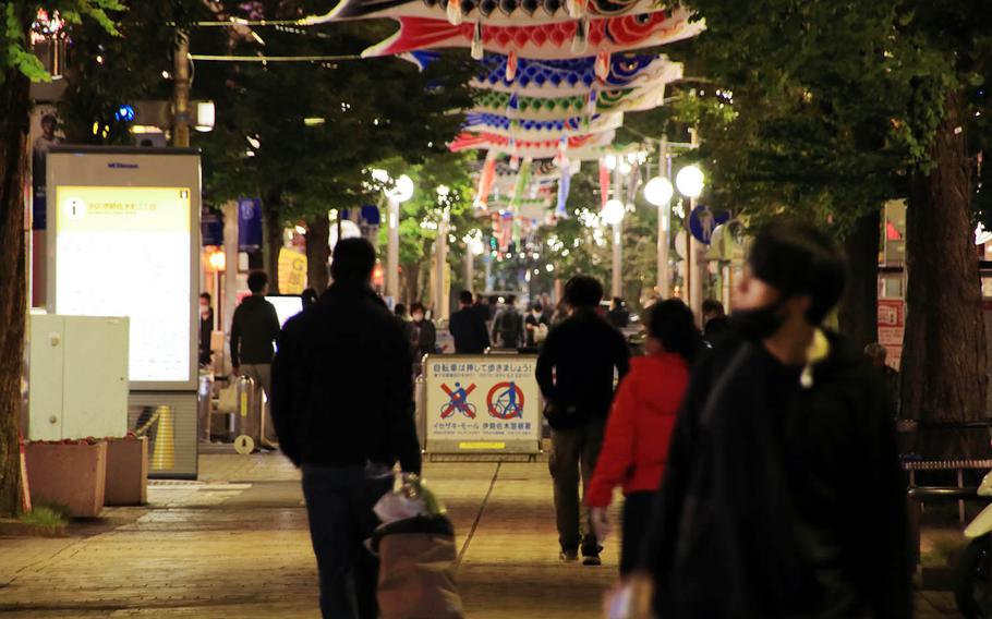 People stroll through central Yokohama on Wednesday evening, April 29, 2020.