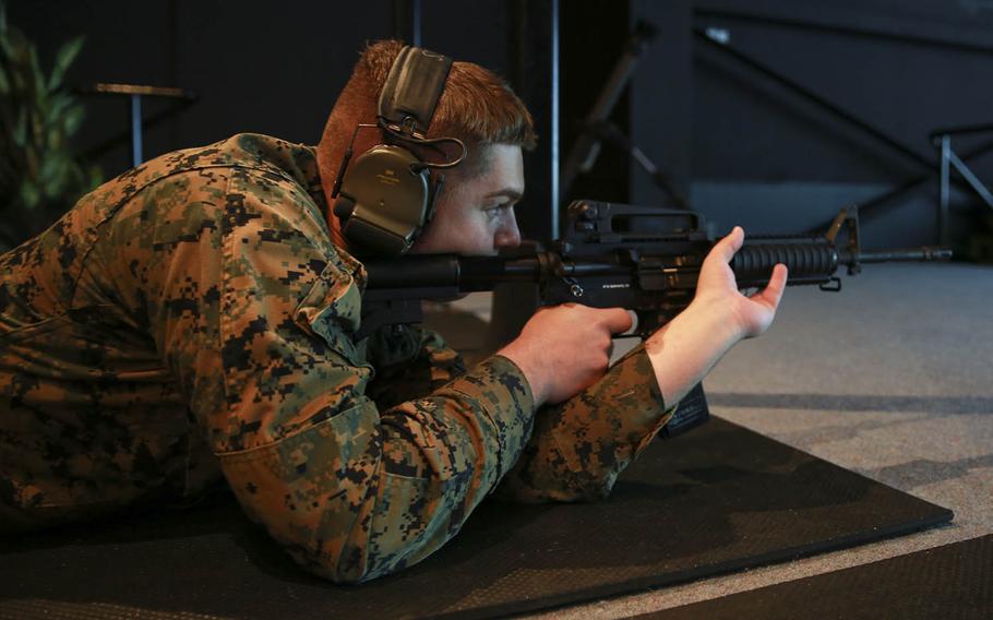 Cpl. Isaiah Fraser, a data system administrator with Marine Rotational Force — Darwin, shoots an M4 carbine at Robertson Barracks in Darwin, Northern Territory, Australia, April 29, 2020.