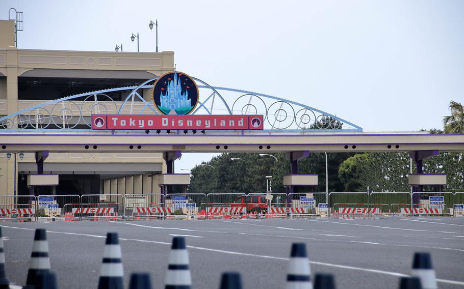 The vehicle entrance to Tokyo Disneyland in Urayasu, Japan, remains blocked off, Tuesday, May 12, 2020. The theme park has been closed since Feb. 29 because of the coronavirus.