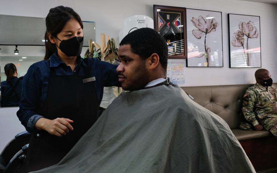 Sgt. Ervin Dunston gets a haircut off base for the first time in months at a barbershop outside Camp Humphreys, South Korea, on Wednesday, May 20, 2020.