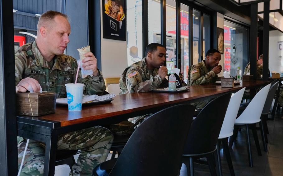 Soldiers assigned to U.S. Forces Korea dine at a restaurant outside Camp Humphreys, South Korea, but continue to maintain social distance on Wednesday, May 20, 2020.
