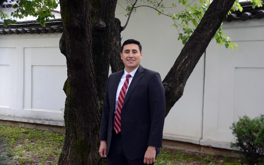 Andres Torres, 34, of Mount Pleasant, S.C., poses outside his office at Yongsan Garrison in Seoul, South Korea, Wednesday, May 27, 2020.