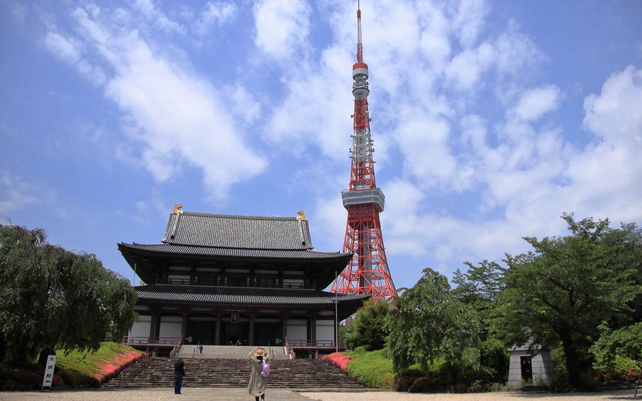 People visit Zojoji, a Buddhist temple near Tokyo Tower, Thursday, May 28, 2020.