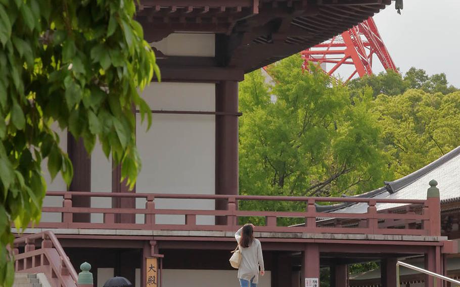 People visit Zojoji, a Buddhist temple near Tokyo Tower, Thursday, May 28, 2020.