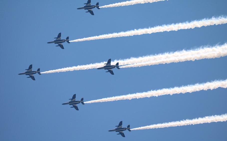 Blue Impulse, the Japan Air Self-Defense Force's aerobatic demonstration team, flies over Mejiro, Tokyo, Friday, May 29, 2020, to show appreciation for health care workers during the coronavirus pandemic.