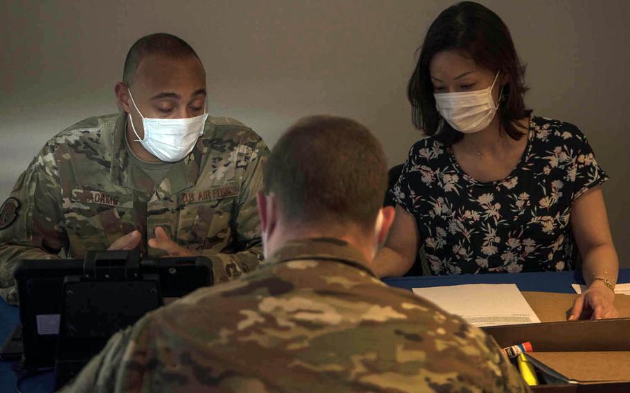 Staffers from the personal property office at Yokota Air Base in Tokyo help an airman set up the transfer of his household goods, Friday, June 5, 2020.