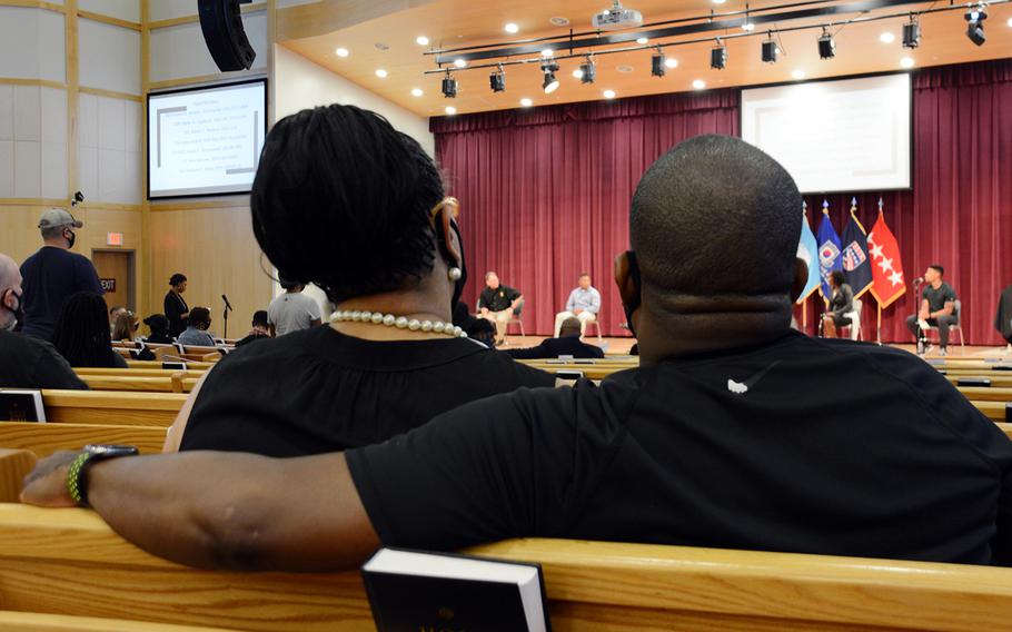 A couple watches from the audience during a panel discussion dubbed "Stronger Together" at Camp Humphreys, South Korea, to address concerns about racism in the military, Sunday, June 7, 2020.