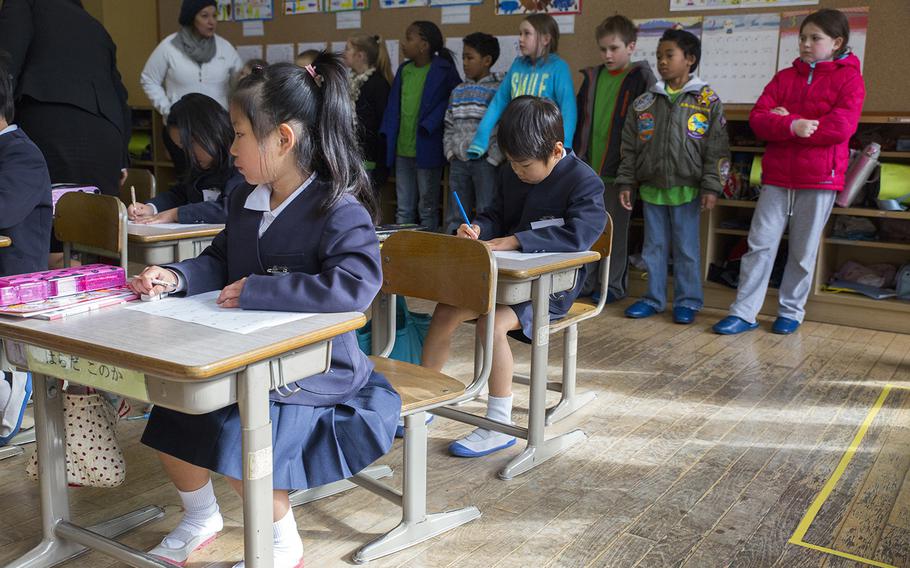 American students visit a classroom at Nishiki Seiryu Elementary School near Marine Corps Air Station Iwakuni, Japan, in 2015.