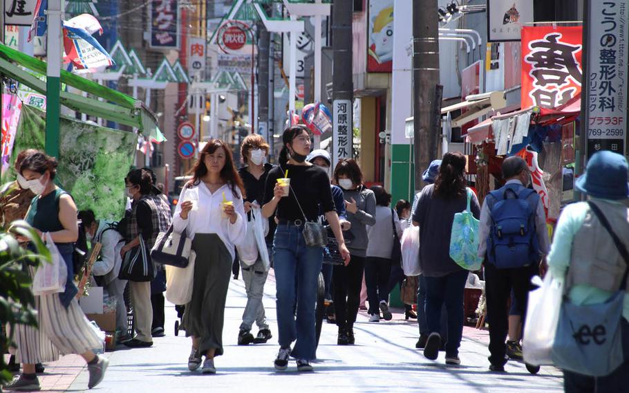 People stroll along a popular shopping street in Yokohama, Japan, May 11, 2020. U.S. Army Japan has relaxed coronavirus-related travel restrictions, but Yokohama and central Tokyo remain off limits. 