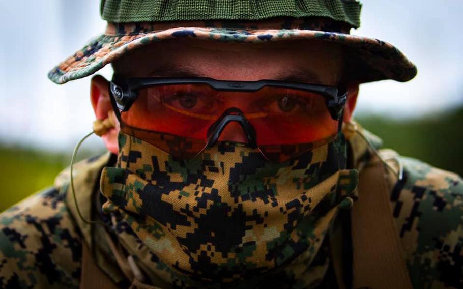 A Marine wears a mask during annual rifle qualifications at Camp Hansen, Okinawa, May 6, 2020.