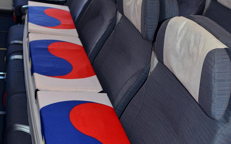 Boxes draped in South Korean flags and containing the remains of unidentified South Korean service members rest aboard a jet set to depart from Hawaii, Tuesday, June 23, 2020.