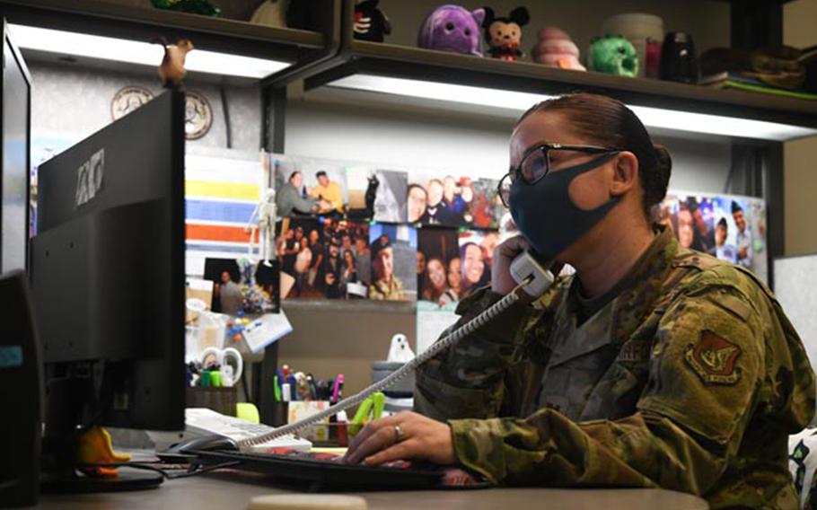 Capt. Heather Bryant, a clinical nurse with the 18th Medical Operations Squadron at Kadena Air Base, Okinawa, screens patients by phone to determine if they meet the criteria for coronavirus testing in this photo posted to the base Facebook page on May 9, 2020.