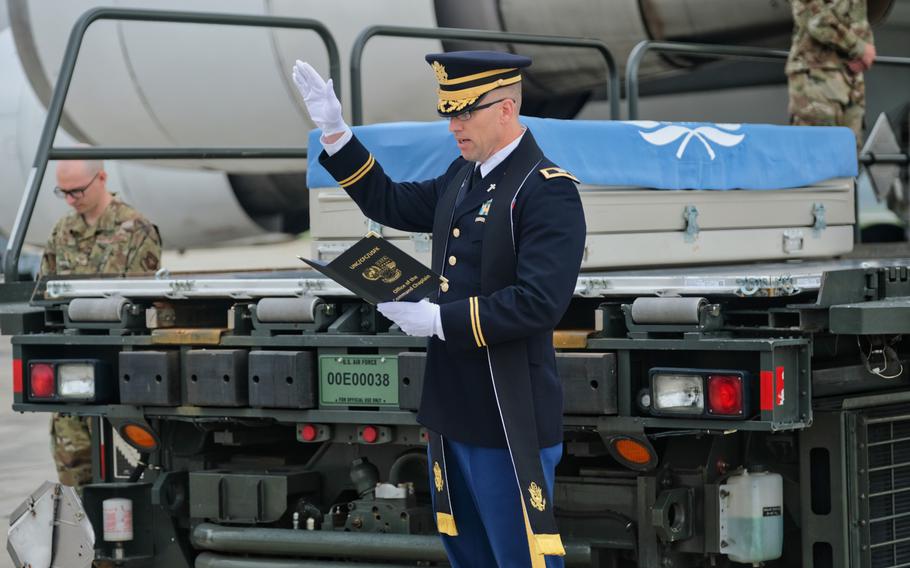 Col. David Bowlus, United Nations Command chaplain, leads a prayer during a repatriation ceremony at Osan Air Base, South Korea, Friday, June 26, 2020.