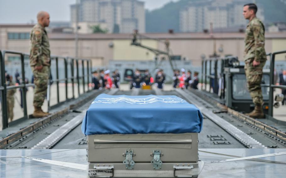 Draped in a United Nations flag, the remains of six unknown service members killed in the Korean War are pictured during a repatriation ceremony at Osan Air Base, South Korea, Friday, June 26, 2020.
