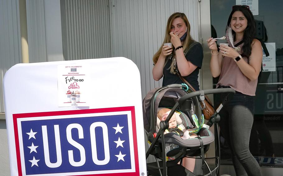 Visitors enjoy free ice cream from the USO after the center reopened at Yokosuka Naval Base, Japan, Monday, June 29, 2020.