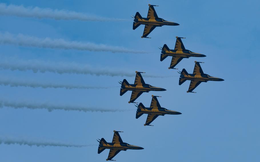 The South Korean air force's aerobatic team, the Black Eagles, conduct a flyover during a Korean War memorial service at Osan Jukmiryeong Peace Park in Osan, South Korea, Sunday, July 5, 2020.