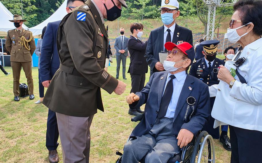 Retired South Korean general Yoon Seung-kook, who served with U.S. troops in Task Force Smith during the Korean War, is greeted by Gen. Robert Abrams, commander of U.S. Force Korea and United Nations Command, during a service at Osan Jukmiryeong Peace Park in Osan, South Korea, Sunday, July 5, 2020.