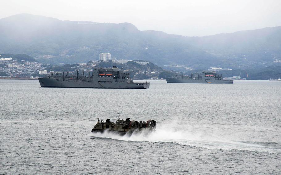 An air-cushioned landing craft makes its way across Sasebo Bay to dry cargo and ammunition ships on Feb. 16, 2016.