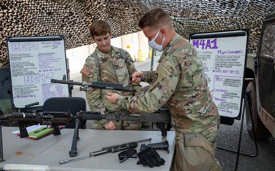 A soldier with the 25th Infantry Division assembles an M240 at Schofield Barracks, Hawaii, June 25, 2020, during preparation for the Lightning Forge exercise that runs through July 21.