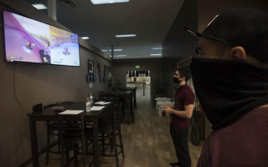A pair of 374th Airlift Wing firefighters compete in a Mario Kart tournament hosted by the USO at Yokota Air Base, Japan, Saturday, July 11, 2020.