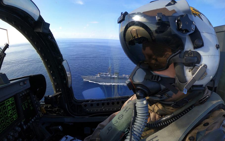 A Navy aviator flies over the South China Sea in an F/A-18E Super Hornet, Tuesday, July 7, 2020.
