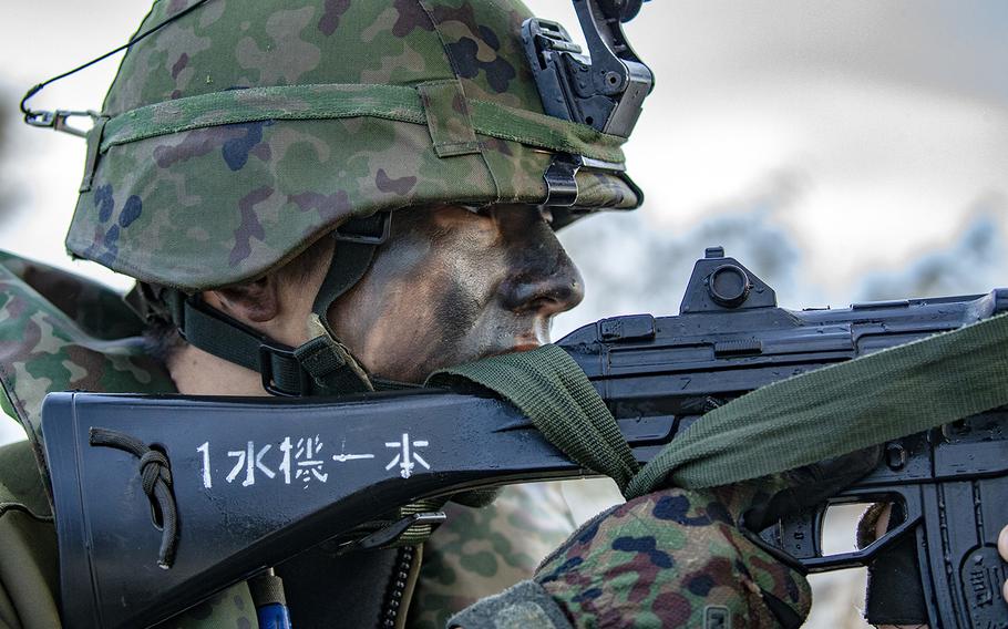 A member with the Japan Ground Self-Defense Force holds security during the Talisman Sabre exercise in Bowen, Australia, July 21, 2019.