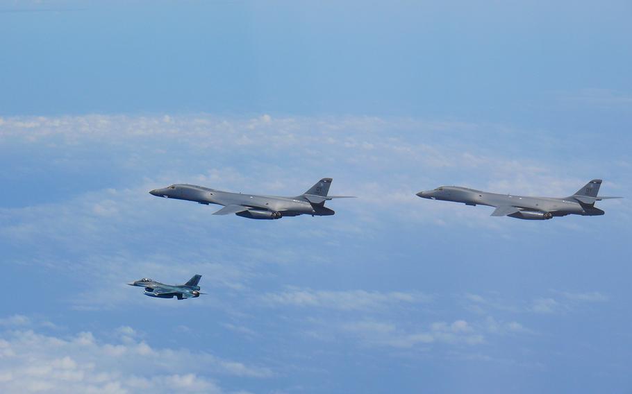 Two Air Force B-1B Lancers fly with a Japan Air Self-Defense Force F-2 fighter jet over the East China Sea, July 7, 2020.