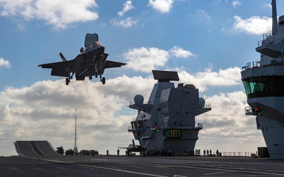 An F-35 Lightning II fighter lands on the HMS Queen Elizabeth in the North Atlantic on Nov. 16, 2018.