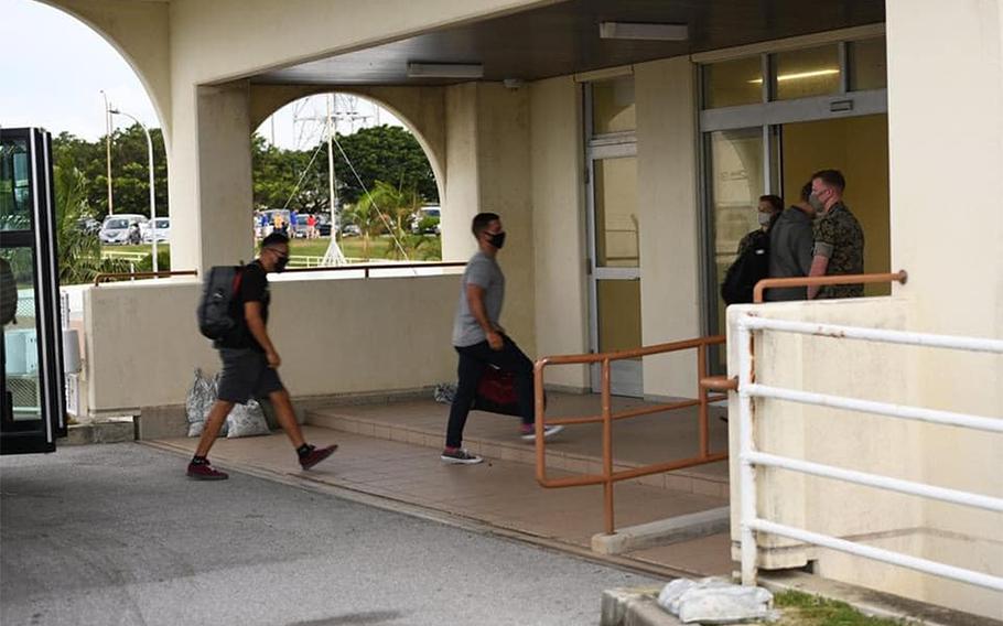 U.S. service members new to Okinawa arrive at Kadena Air Base in this photo posted to the 18th Wing's Facebook page on July 27, 2020. All were moved into 14 days of restriction of movement and will be tested for coronavirus before being released.