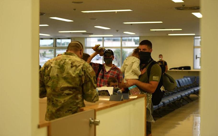 U.S. personnel new to Okinawa arrive at Kadena Air Base in this photo posted to the 18th Wing's Facebook page on July 27, 2020. All were moved into 14 days of restriction of movement and will be tested for coronavirus before being released.