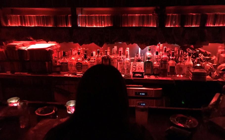 A customer sits inside Rock Bar Mother in the popular Kabukicho entertainment district of central Tokyo, May 4, 2018.