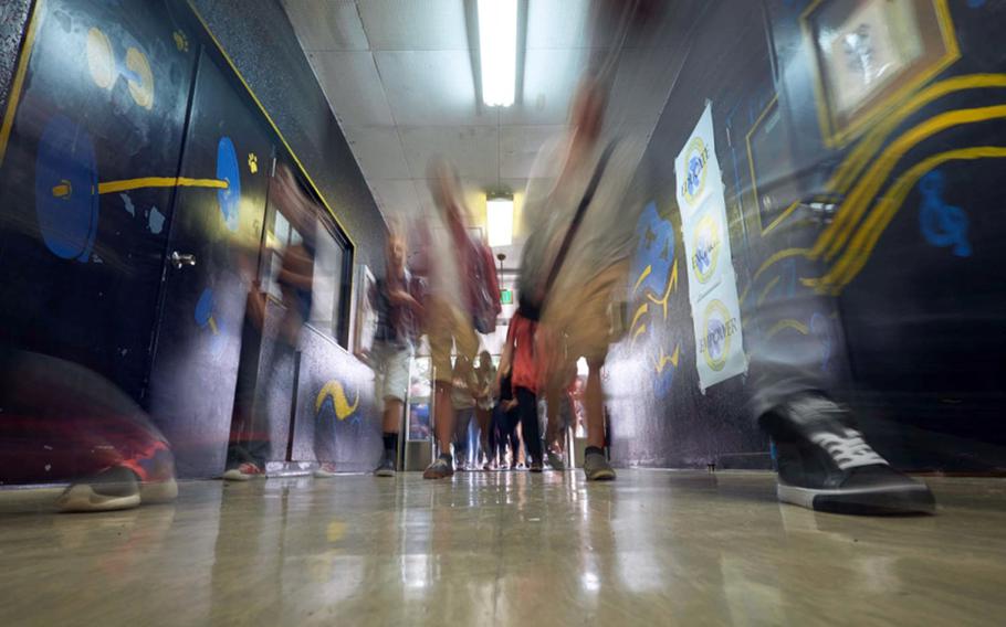 Students and staff return to Yokota High School at Yokota Air Base in western Tokyo on Aug. 31, 2015.