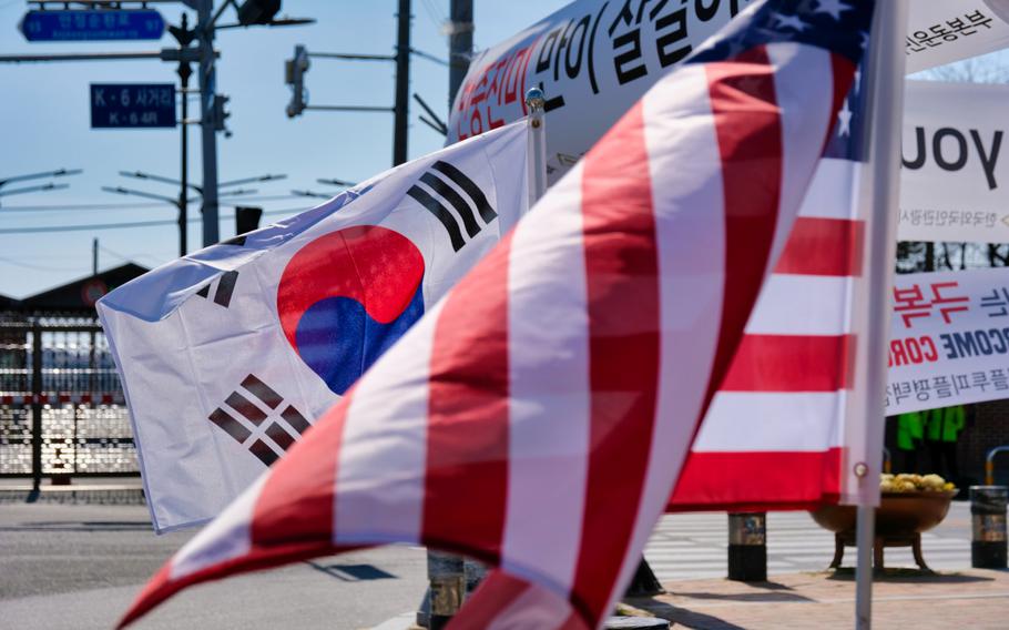 American and South Korean flags are displayed together outside Camp Humphreys, South Korea, March 16, 2020. 