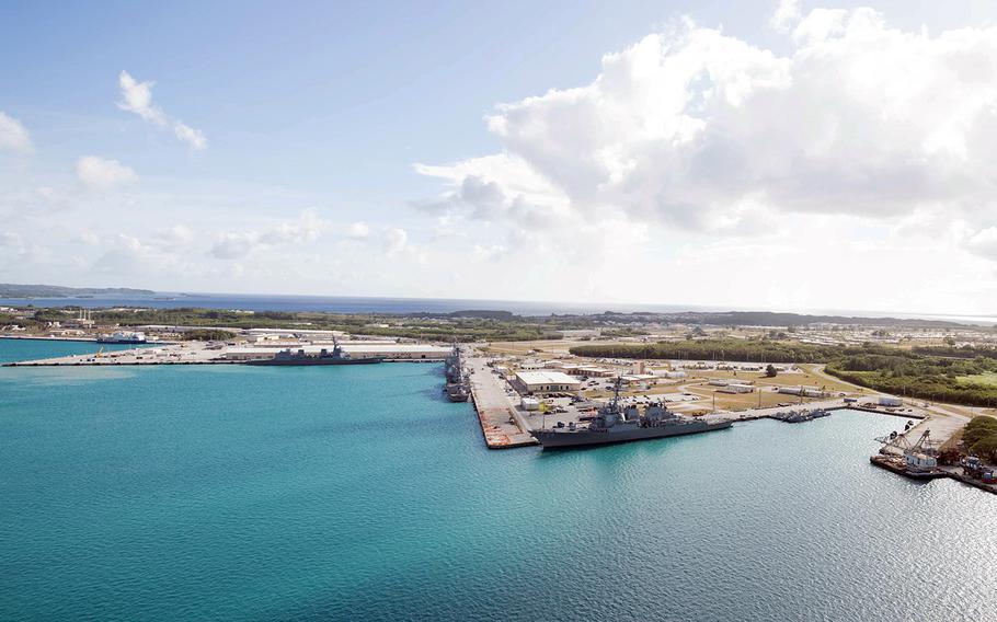 This aerial view of U.S. Naval Base Guam shows several Navy vessels moored in Apra Harbor, March 15, 2018.