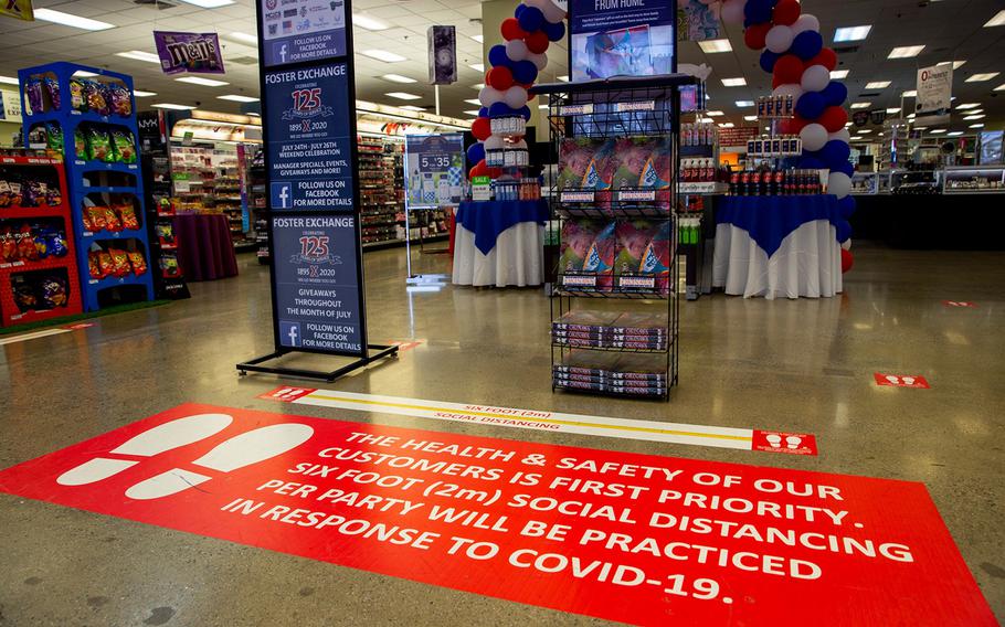 Floor decals urge exchange shoppers to practice social distancing at Camp Foster, Okinawa, July 29, 2020.